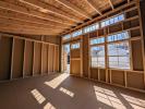 Interior of 10x14 modern lean-to storage shed showcasing the natural light let in through the row transom windows